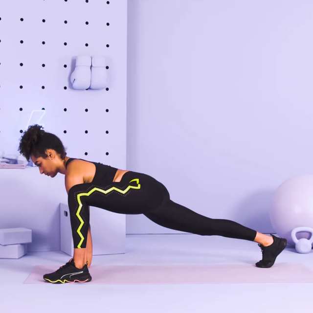 trainer performing low lunge with arm reach
