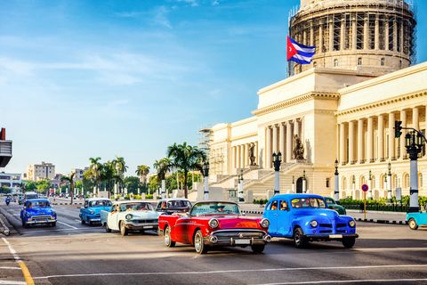 vintage cars in front of capitolio in la habana cuba