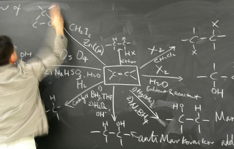 man writing complicated equation
