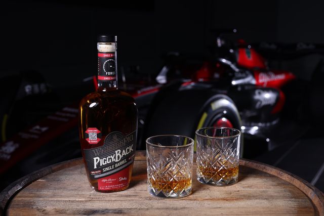 whistlepig rye whiskey and glasses with f1 car