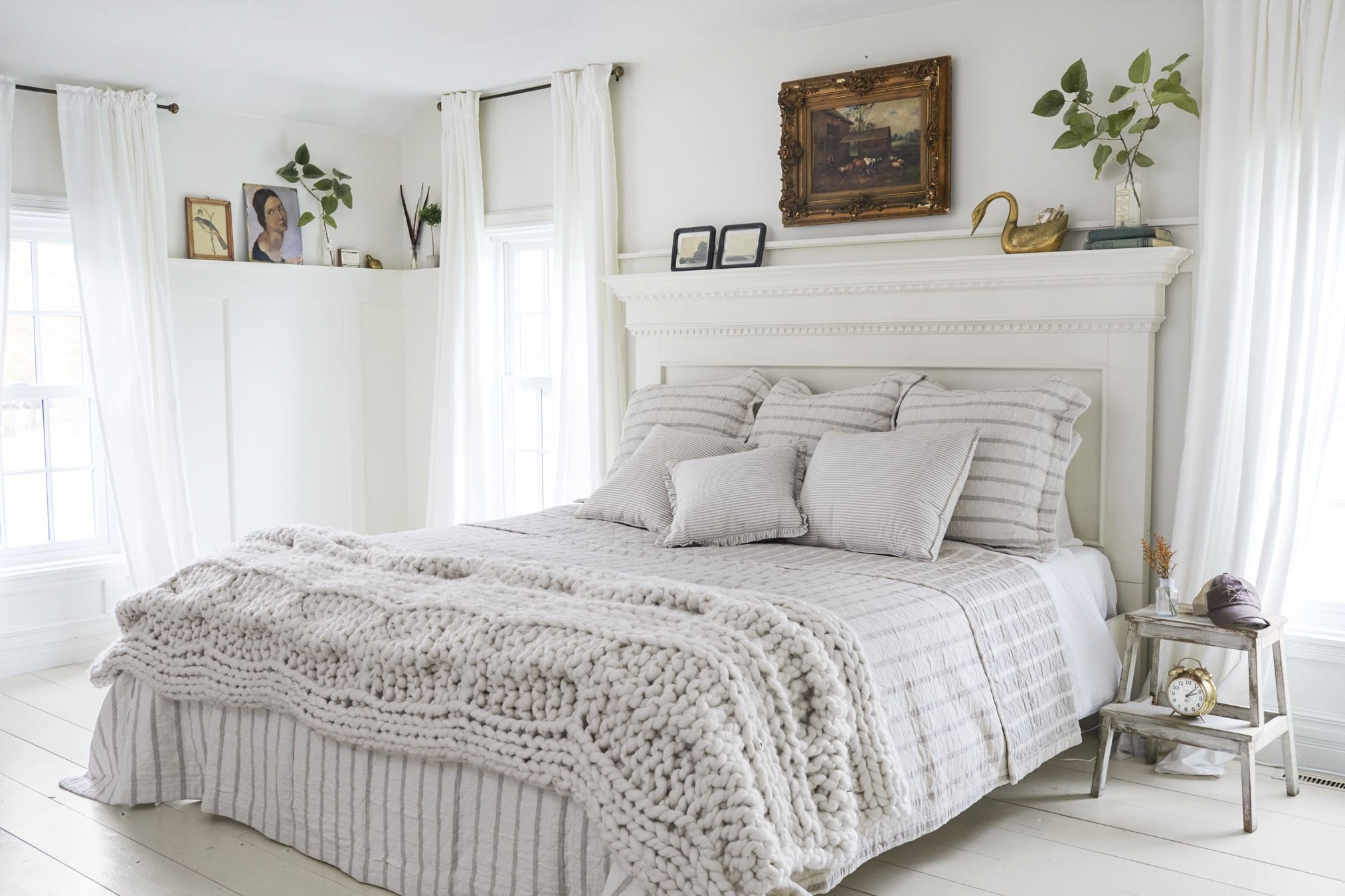 white bedding with colorful pillows