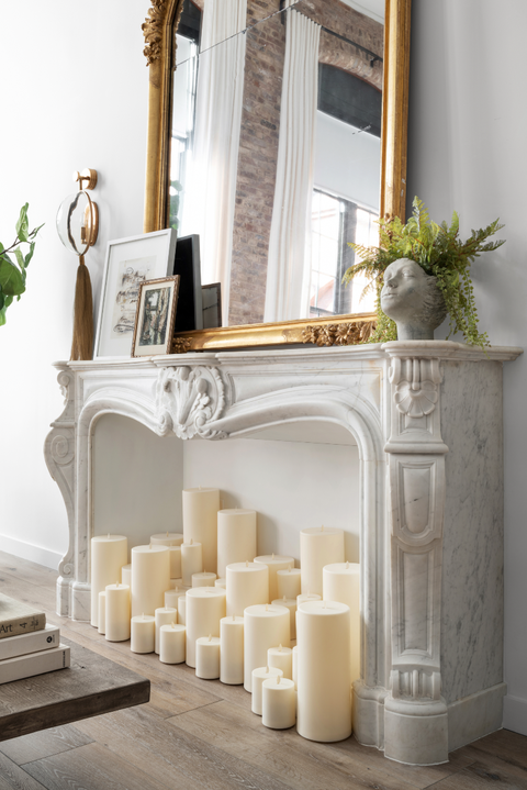 white candles in fireplace