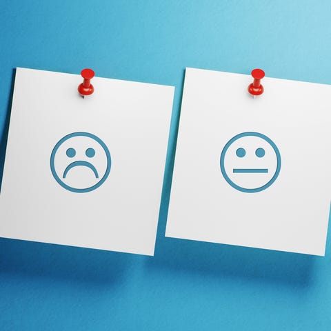 White Post It Notes Imprinted With Feedback Symbols On Blue Background White Post It Notes Imprinted With Feedback Symbols On Blue Background