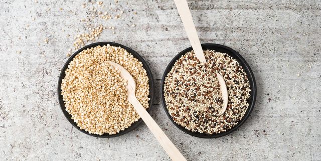wholemeal quinoa and popped quinoa in bowls, wooden spoons