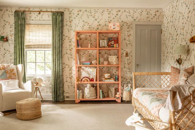 nursery, floral wallpaper, green curtains, day bed, peach bookshelf, rocking chair, children's toys