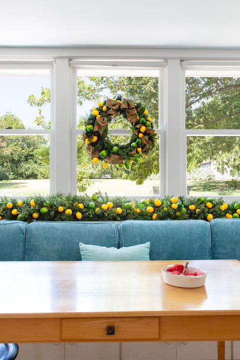 citrus holiday wreath in window