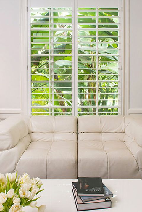 white sofa by window