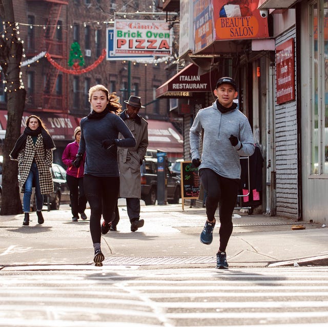 two runners at a crosswalk