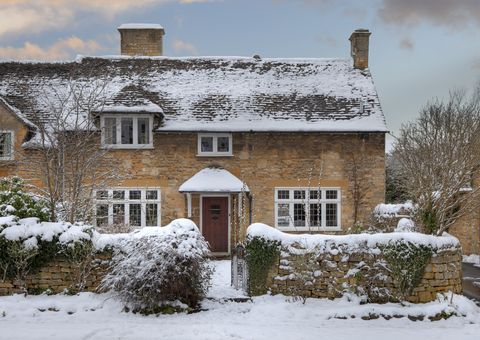 pretty cotswold cottage in snow, broadway, worcestershire, england
