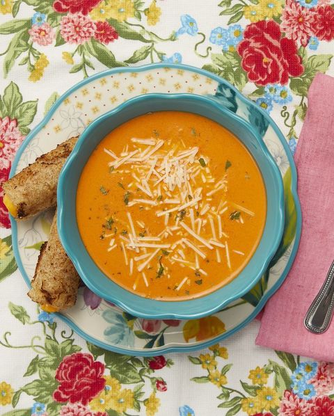creamy roasted red pepper soup on floral background