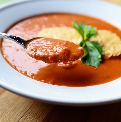 tomato soup with parmesan croutons with spoon