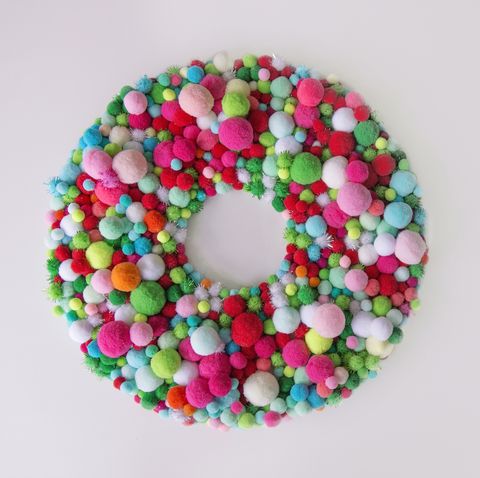 christmas wreath with multi colored pom poms