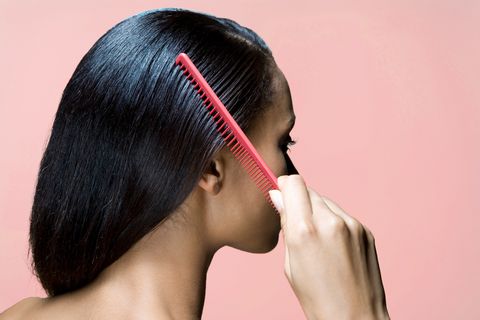 woman combing hair