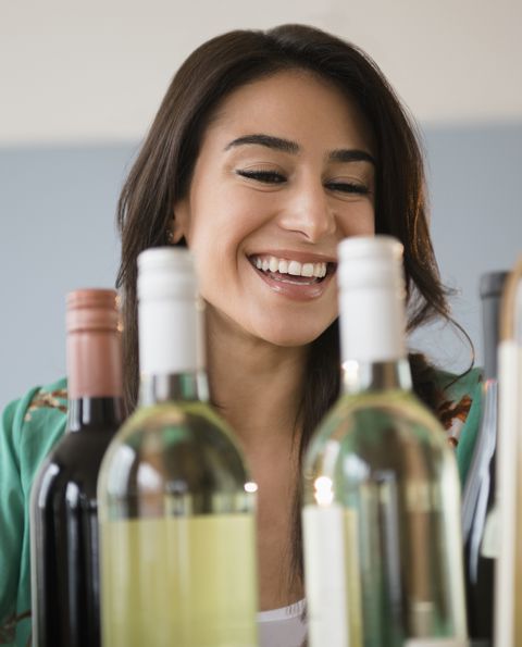 woman choosing bottle of wine