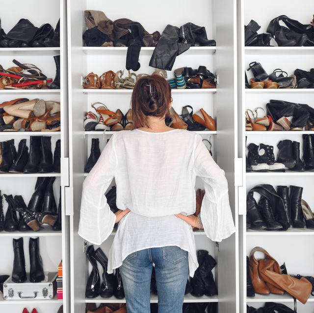 woman cleaning shoes closet