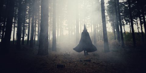 woman-dressed-as-a-witch-walking-through