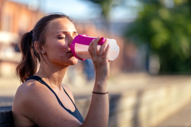 woman drinking protein shake
