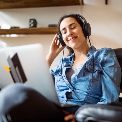 Woman enjoying listening online music