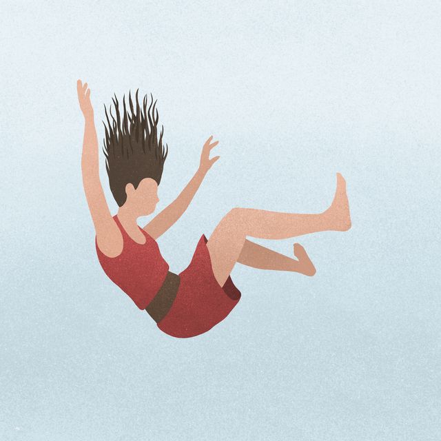 a woman falling against a blue background