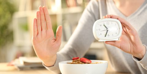 woman hands on intermittent fasting doing stop sign