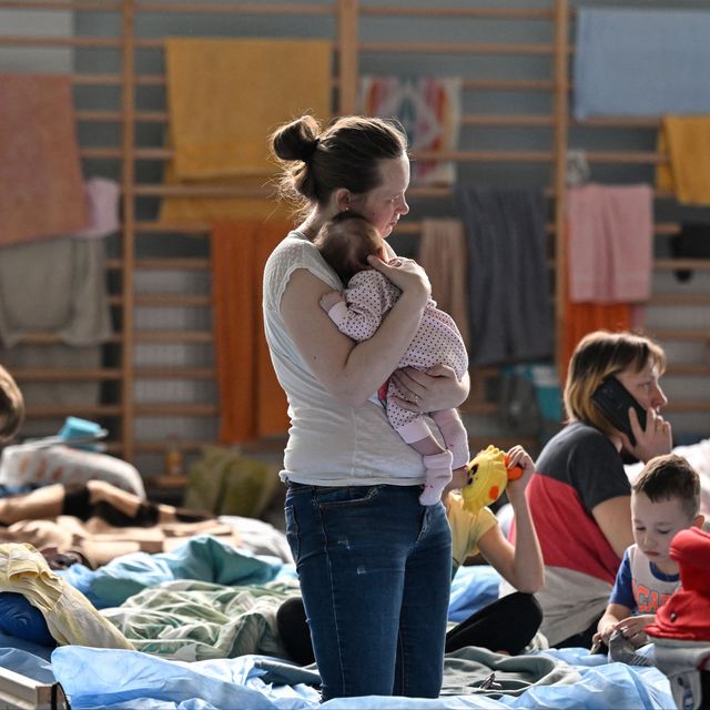 women refugee holding a baby