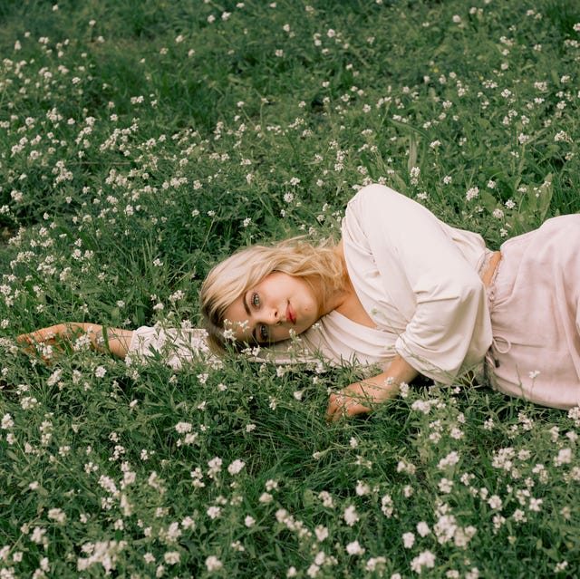 Woman lying on grass in summer woman lying on grass in summer