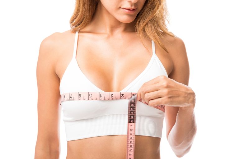 Woman-measuring-her-chest-size-over-white-royalty-free-image-1620287582
