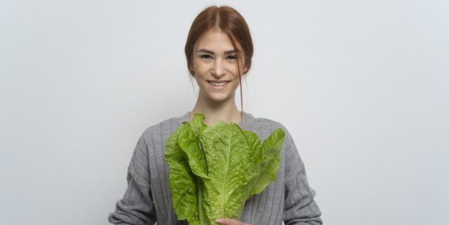 woman old a green lettuce leaves