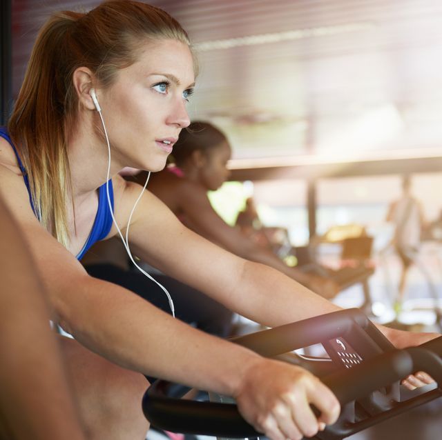woman on exercise bike in gym