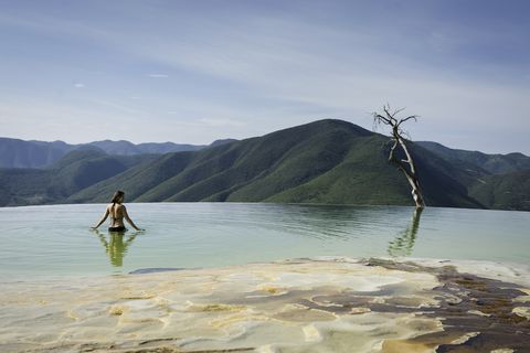 Woman relaxing in thermal spring, Hierve el Agua, Oaxaca, Mexico.