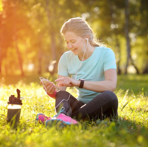 self care ideas woman runner sitting on the grass