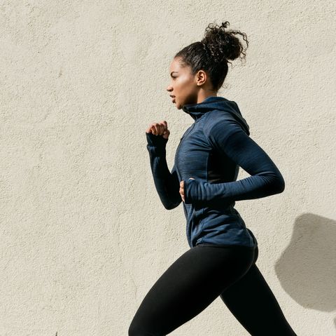 Woman Running Against Wall