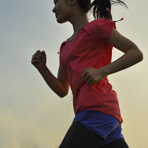 woman running for exercise at sunset