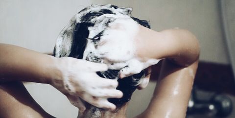 Woman Shampooing Her Hair