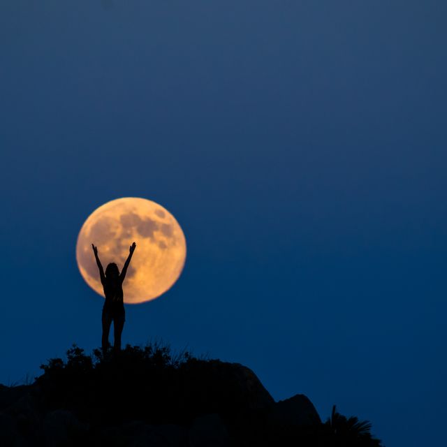 woman silhouette on the full moon