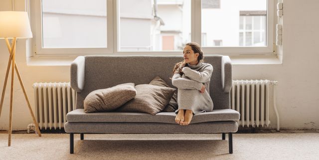woman sitting on couch looking sideways