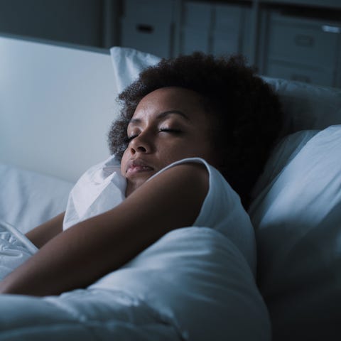 Woman sleeping in her bed Woman sleeping in her bed