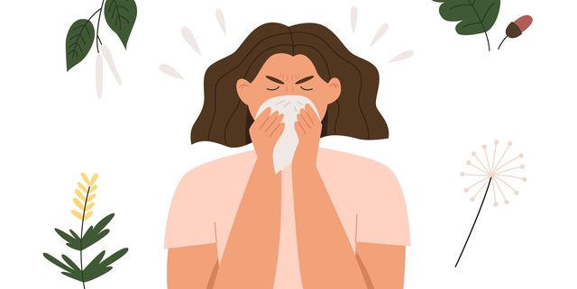 woman sneezes from plant allergy