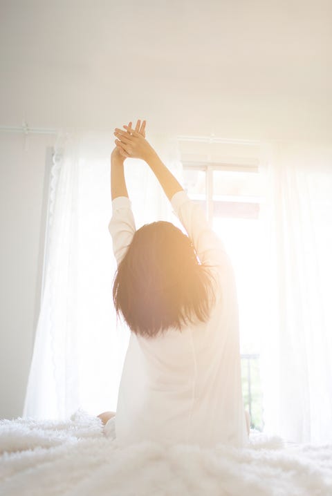 woman stretching in the morning woman stretching in the morning