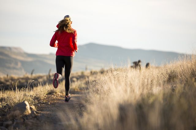 a woman trail running