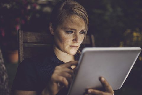 woman using tablet outdoor