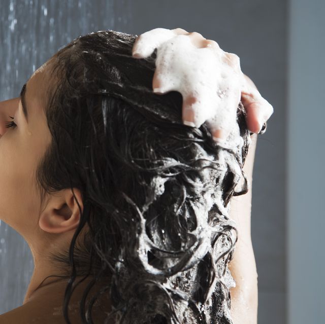 woman washing her hair in shower
