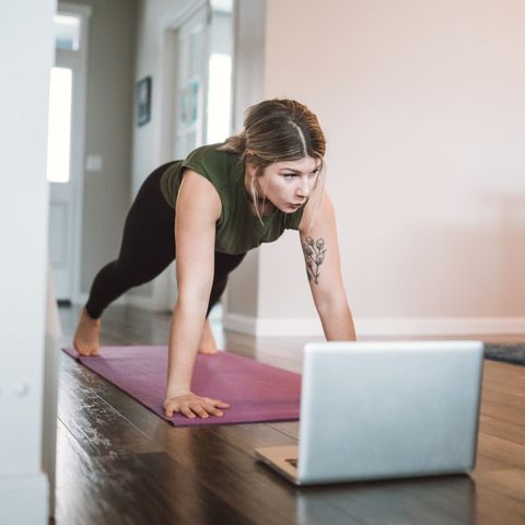 Woman Watching Exercise Tutorials Online