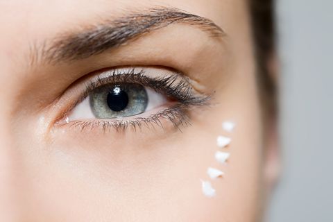Woman with eye cream