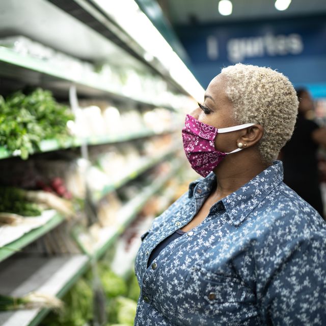 woman with face mask shopping at supermarket