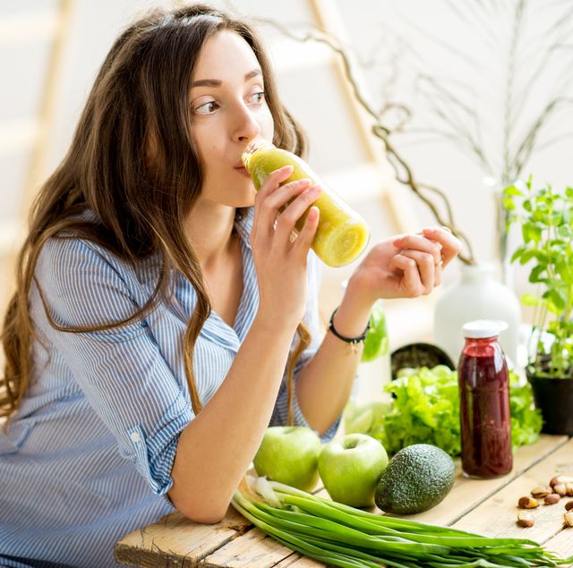 woman with green healthy food at home