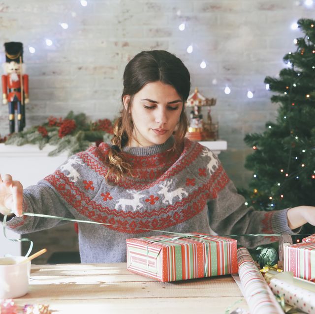 woman wrapping christmas gifts