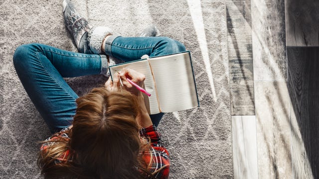 Woman writing into her diary. woman writing into her diary