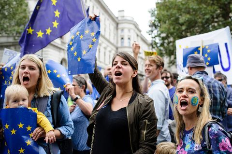 A group of women react to a group of pro-"Brexit"
