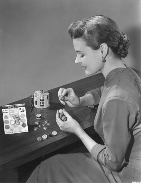 Woman Making Buttons with Kit